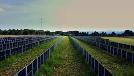 retreating aerial view of photovoltaic system installed among crops