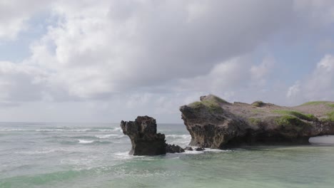 Low-flying-shot-over-Indian-ocean-Island-in-Watamu,-Kenya