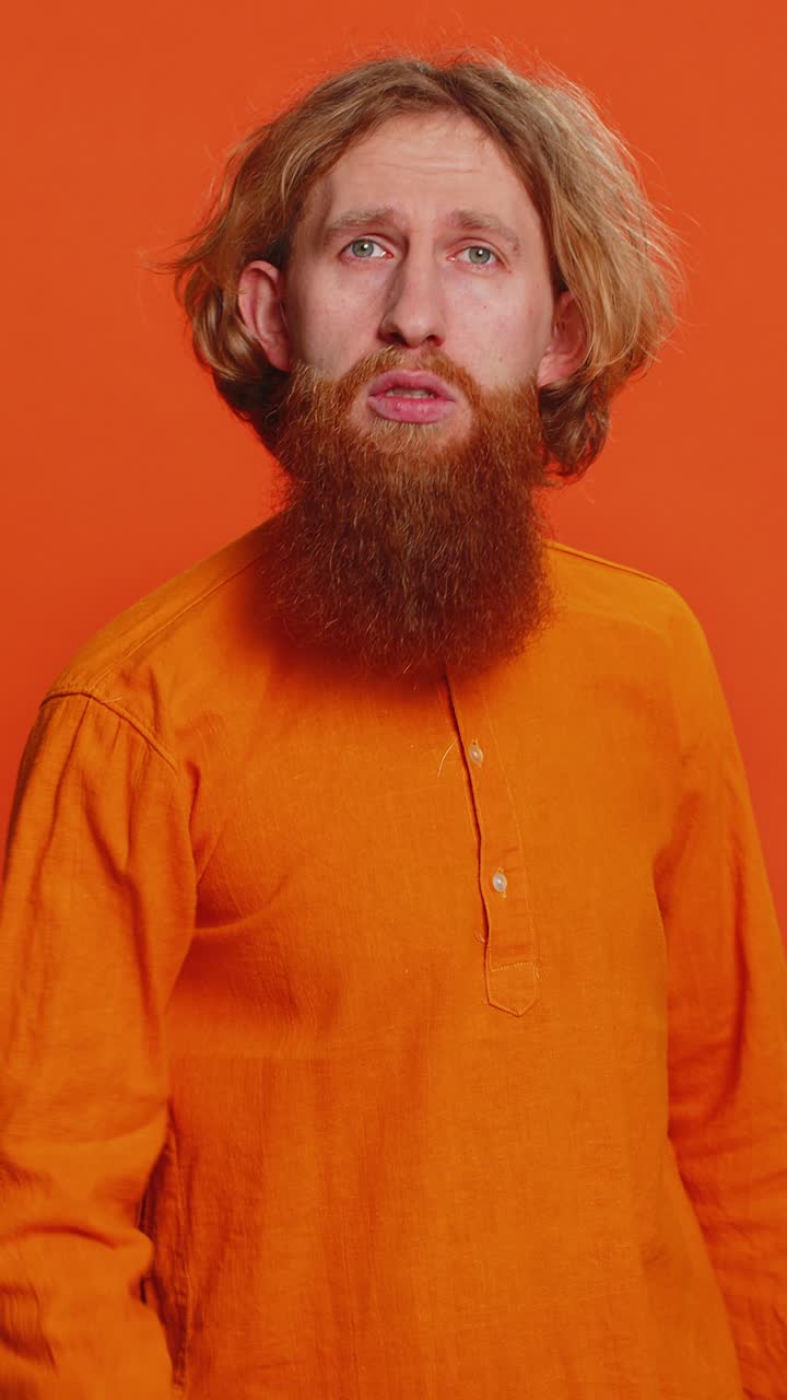 Aggressive angry caucasian man trying to fight at camera shaking fist boxing punishment threaten