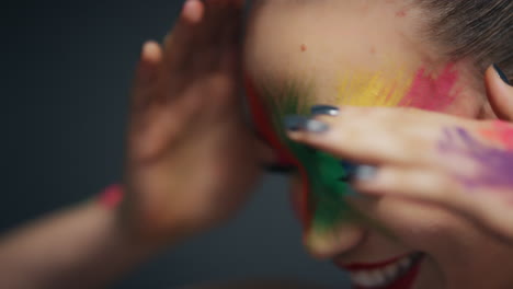 close-up-portrait-beautiful-woman-wearing-colorful-face-paint-dancing-exotic-multicolored-body-art-with-light-flashing