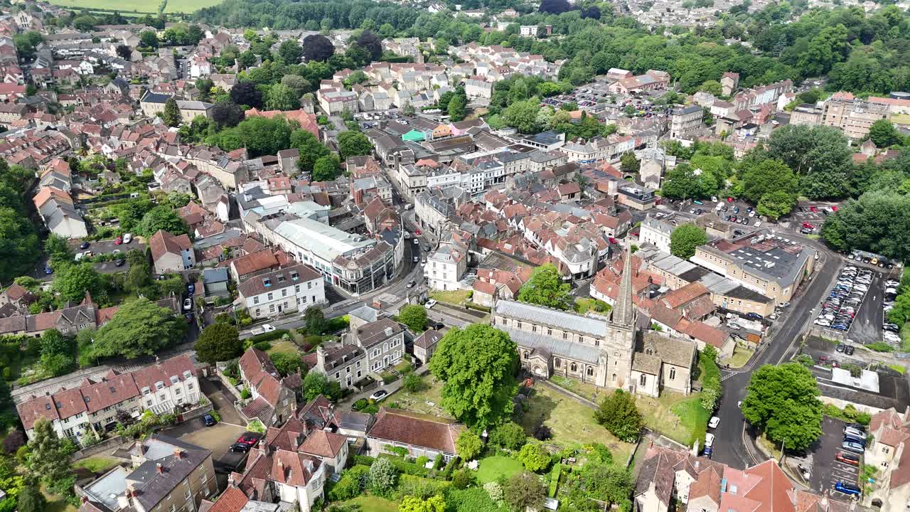 Pull back drone aerial reverse reveal Frome town centre in Somerset UK