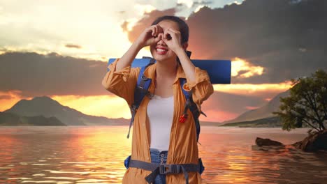 woman hiking at sunset by the lake