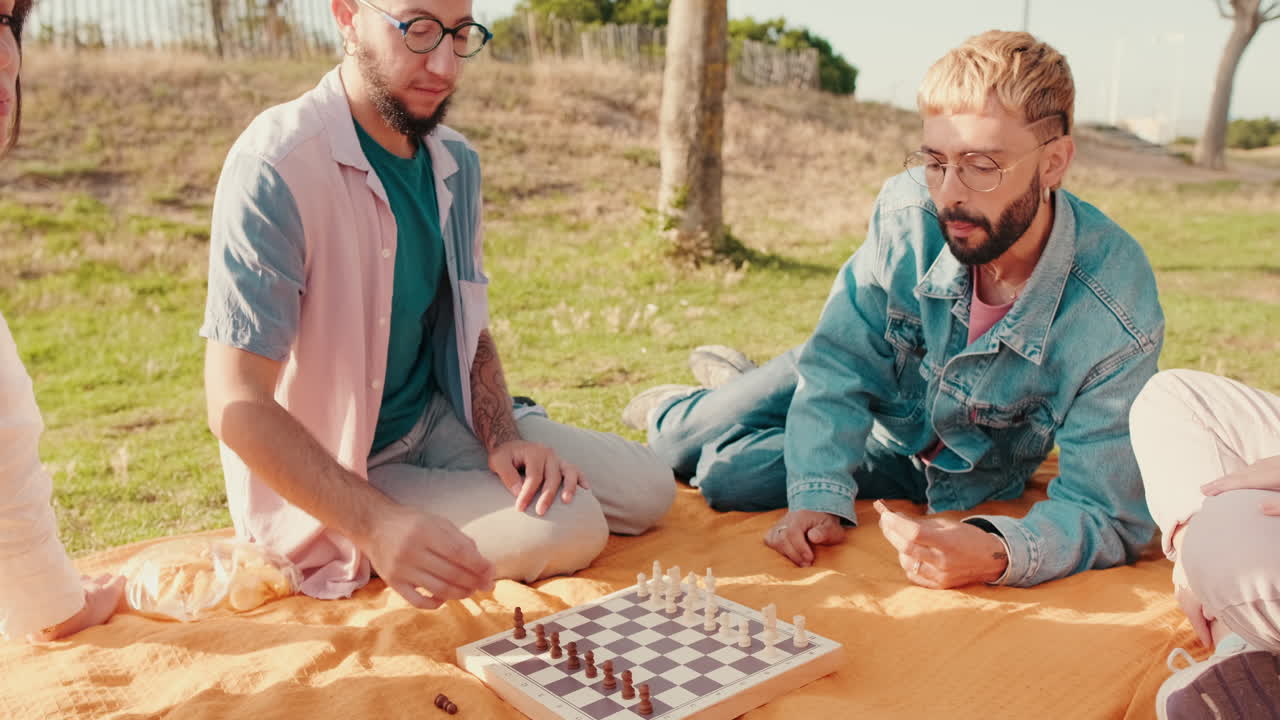 Friends Playing Chess at a Park Picnic