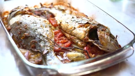 baked sea bream dish with potato and tomato