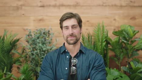 attractive young man portrait of confident caucasian guy arms crossed smiling at camera successful entrepreneur