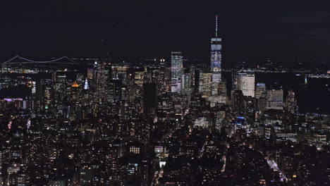 Lower-Manhattan-night-skyline-view-with-glittering-skyscrapers,-New-York,-USA