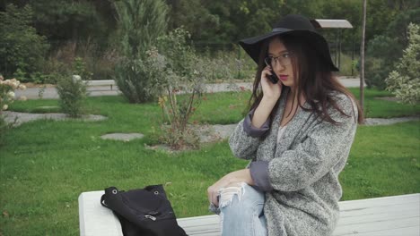 young woman on a phone call in a park
