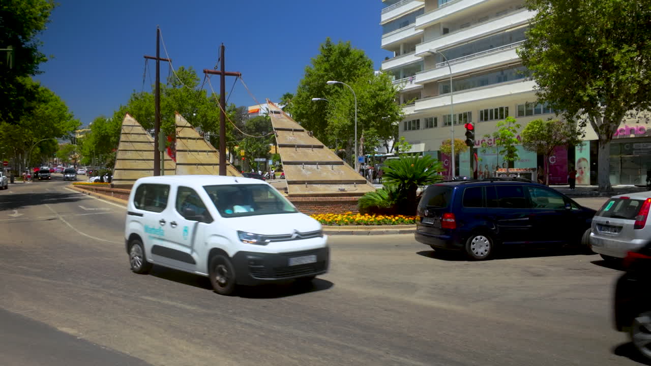 Busy City Street Scene with Unique Fountain Sculpture