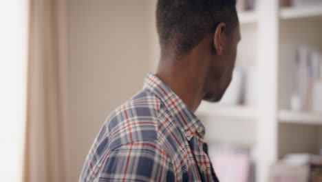 portrait young african american man turns head looking at camera confident male masculine beauty testimonial concept 4k footage