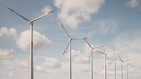 3d wind farm with green field in the background. alternative renewable energy generation. environmental conservation concept. realistic 3d animation wind turbines