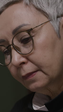 close-up of a woman with glasses