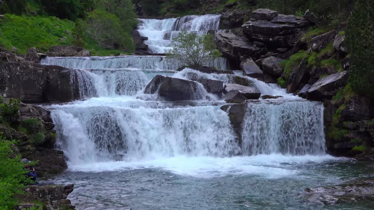 Pond near waterfall in mountains