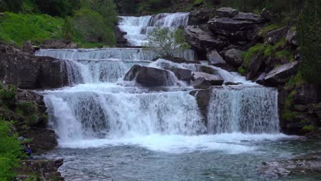 Pond-near-waterfall-in-mountains