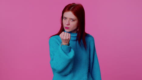 Aggressive-angry-girl-trying-to-fight-at-camera,-shaking-fist,-boxing-with-expression,-punishment