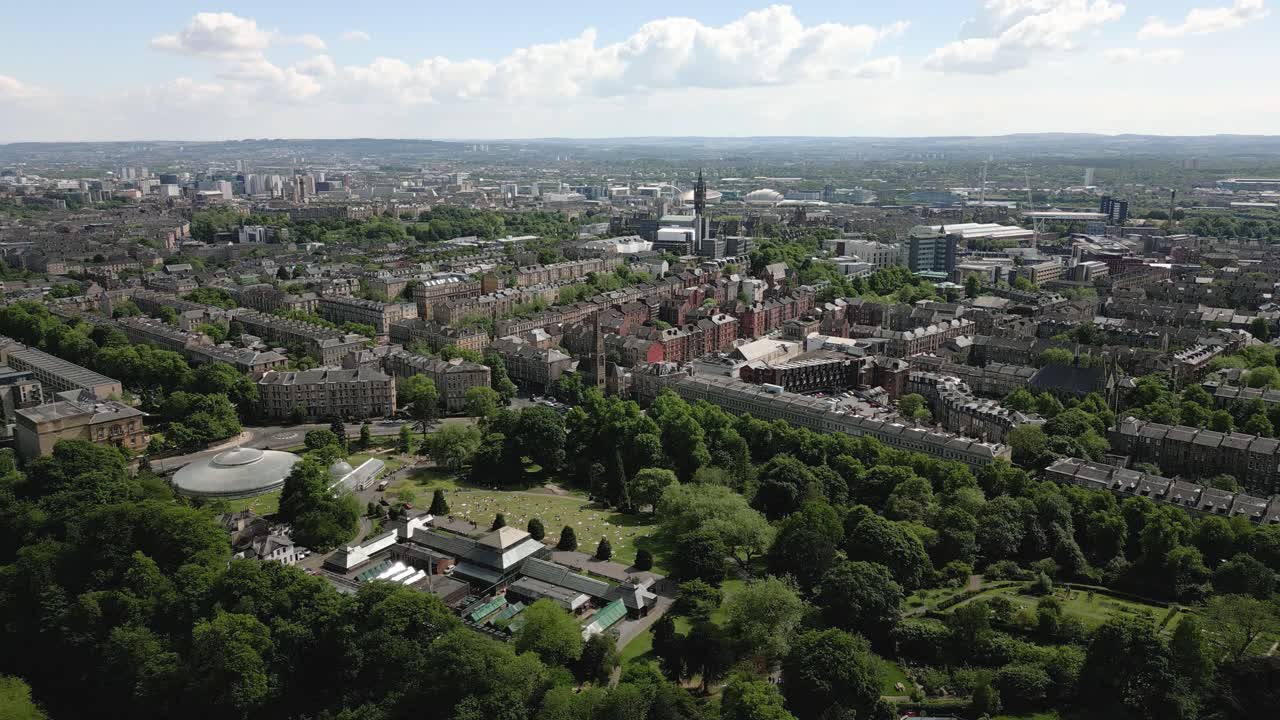 Aerial orbit around Kibble Palace and Glasgow Botanic Gardens, Glasgow, Scotland, UK