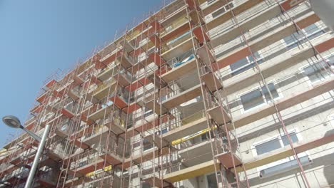 Low-Angle-Shot-Of-A-Tall-Building-Site-During-The-Day