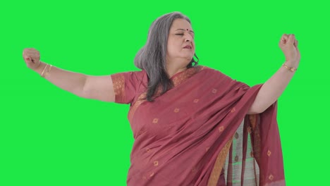 Tired-and-Lazy-Indian-old-woman-yawning-Green-screen