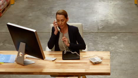 female manager talking on telephone