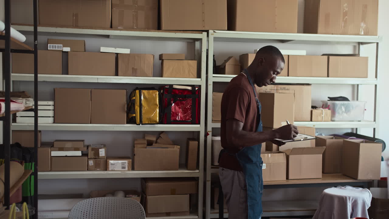 Male Manager Accounting Packages in Storage Office