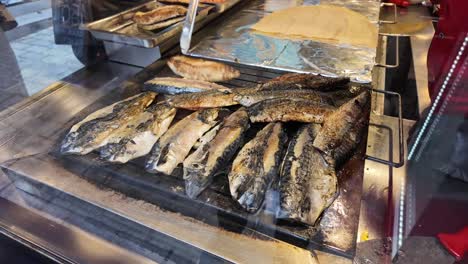 grilled mackerel at a street food stall