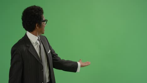 businessman gesturing with arms on green screen