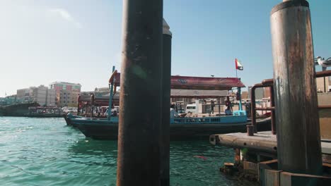 Traditional-Abras,-Wooden-Boats-Parked-At-Dubai-Creek