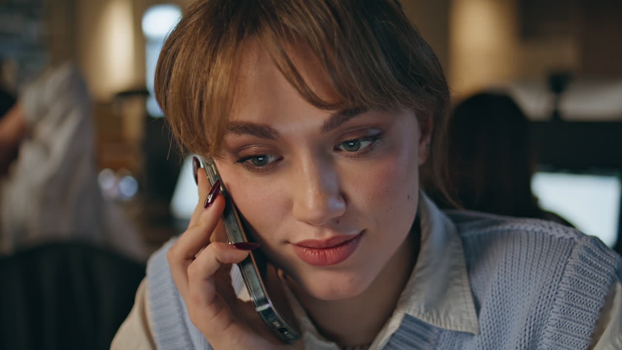 Evening woman calling cellphone working office closeup. Lady waiting answer