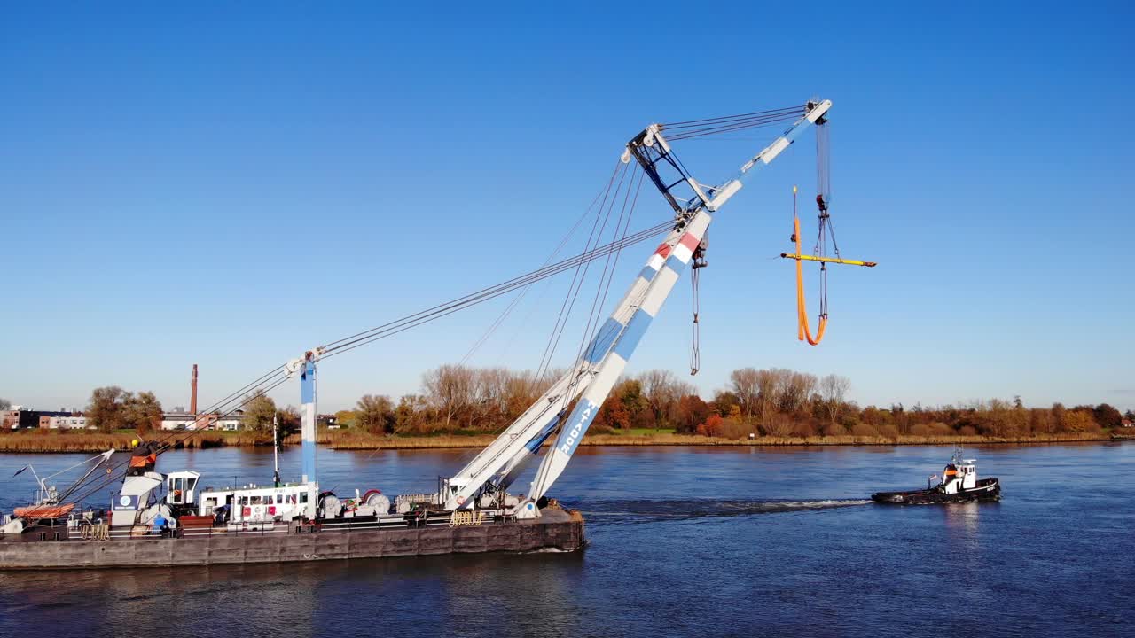 Floating Crane And Tugboat On The River In Barendrecht, Netherlands
