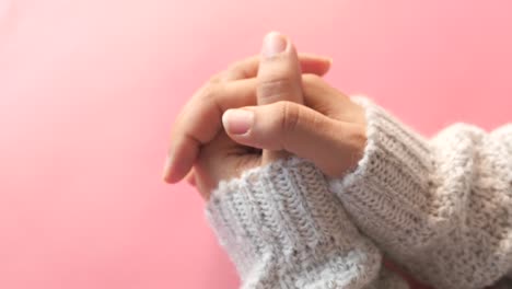 woman's hands in knitted gloves