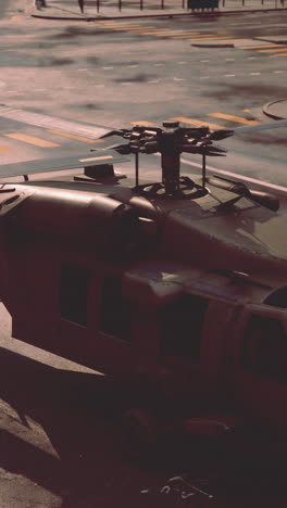 a close-up of a black hawk helicopter on a city street.