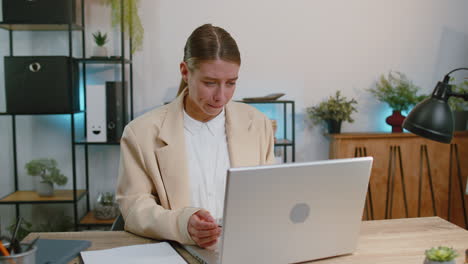 upset businesswoman showing thumbs down dislike bad work disapproval dissatisfied feedback at office