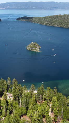 emerald bay, lake tahoe, california usa, vertical revealing drone shot of fannette island and landscape