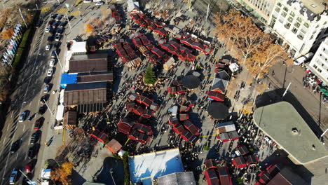 drone shot of the traditional christmas market in zurich, switzerland: establishing shot