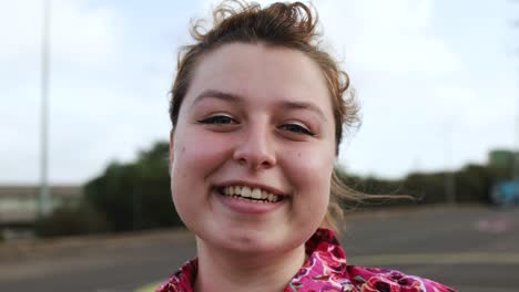 young woman smiling on camera