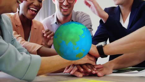 animation of globe over work colleagues stacking hands in background