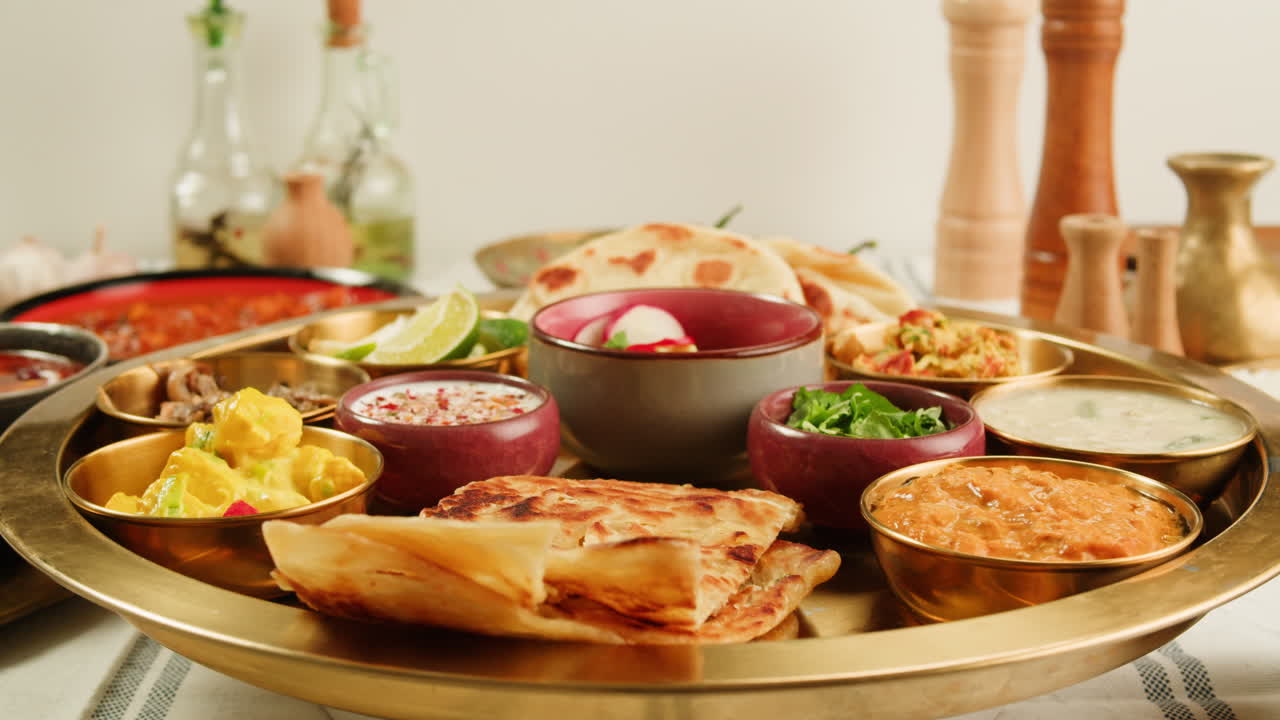 Close-up view of a delicious spicy curry served in a colorful bowl with a spoon, ready for a tasty meal.