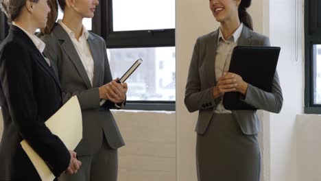 businesswomen talking together