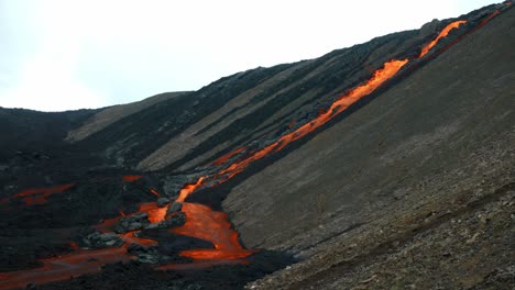 Flow-of-Lava-from-the-Crater-from-the-Volcanic-Eruption-Fagradalsfjall-In-Iceland---aerial-drone-shot