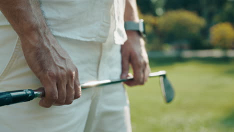 golfer holding golf club