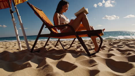 woman reading on beach