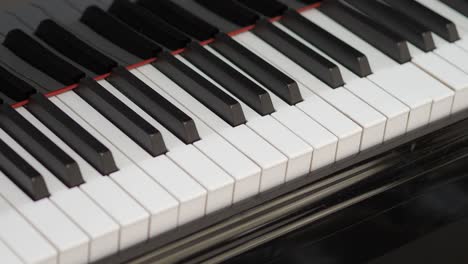 grand piano. professional piano keys self playing. close-up seamless loop. for classical musical music education. black and white piano keys that play on their own. ai self playing without pianist.