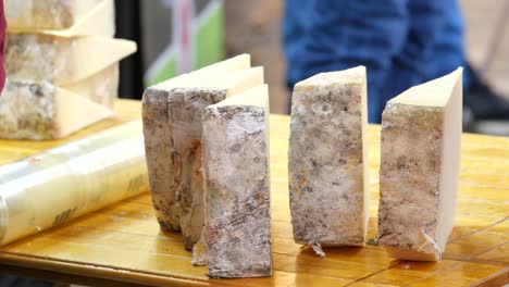 display of aged cheese at a market