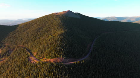 Cinematic-aerial-drone-Denver-front-range-foothills-Rocky-Mountains-Idaho-Springs-Evergreen-Mount-Evans-14er-wilderness-drive-up-Squaw-pass-Echo-Mountain-sunrise-golden-hour-smile-in-forest-forward