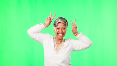 Peace-sign,-funny-and-face-of-woman-on-green