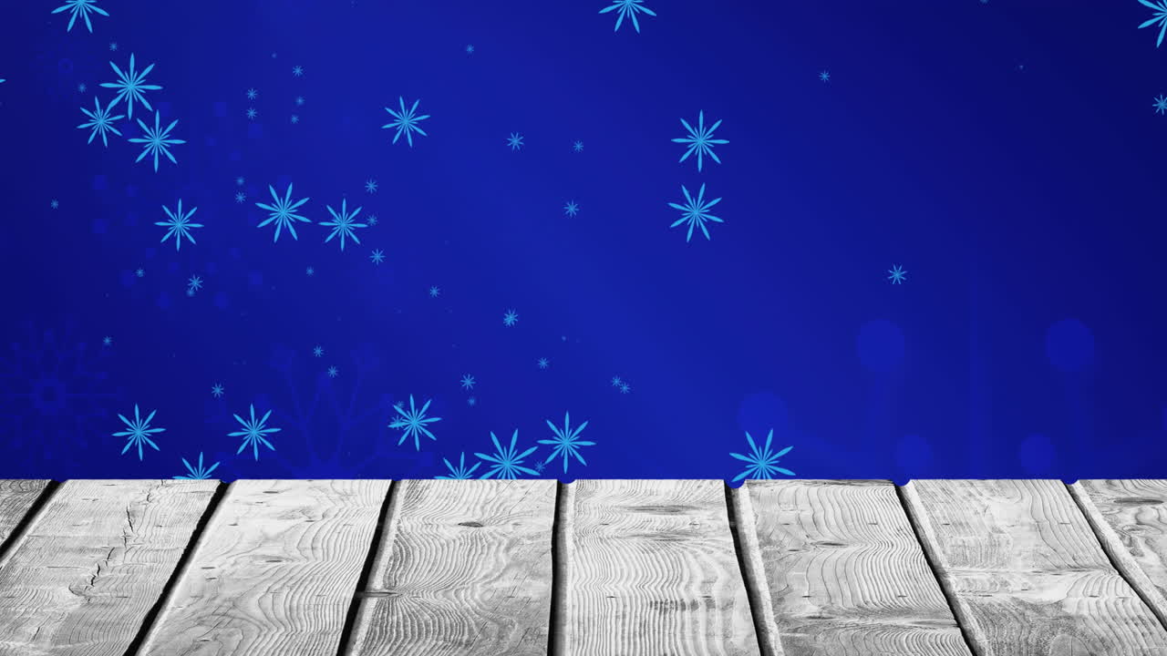 Animation of falling snowflakes on blue background and wooden floor