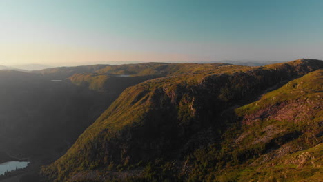 beautiful mountains and landscape in the sunset - aerial 4k