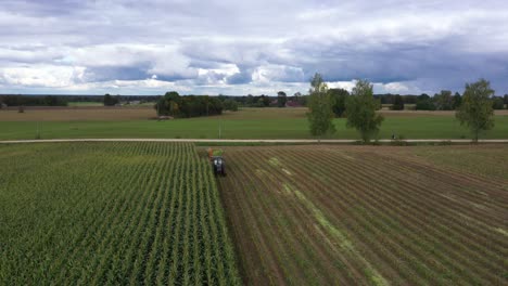 country lifestyle harvesting cornfields for biomass silage passerby