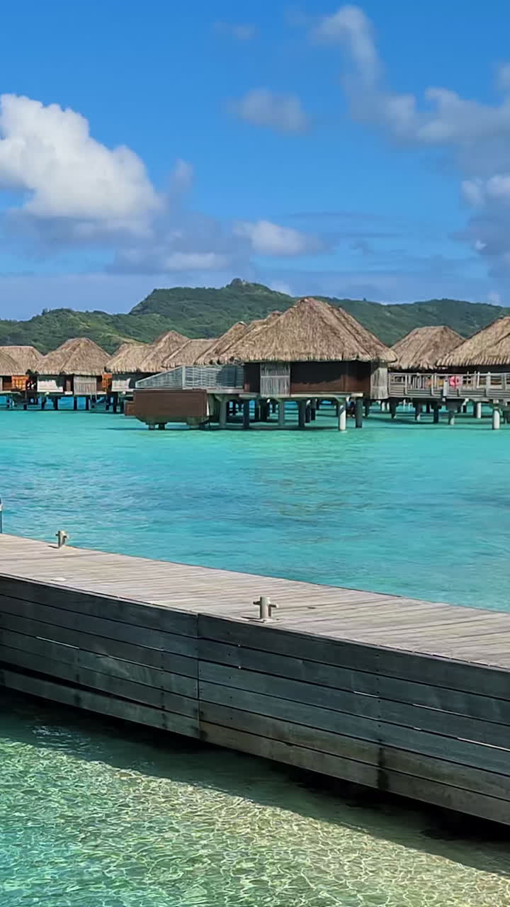 Bora Bora Island, French Polynesia. Vertical View of Overwater Bungalows of Luxury Tropical Resort