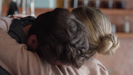 unhappy woman hugging boyfriend young couple having relationship trouble embracing emotional issues sharing bad news
