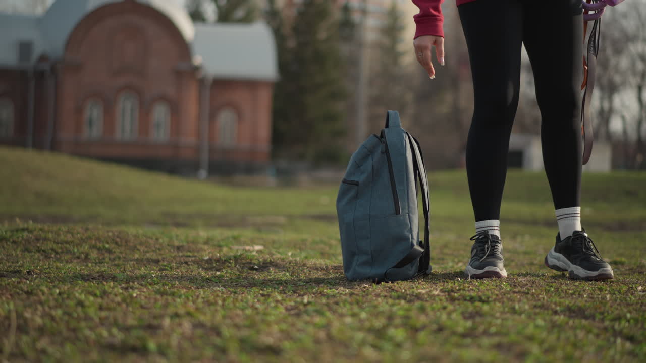 Woman Walks Dogs, Female Strolling With Multiple Leashes Outdoors, Woman Navigating Open Terrain With Several Leashes And Bag, Woman Walking Through Open Field Holding Multiple Leashes And Bag